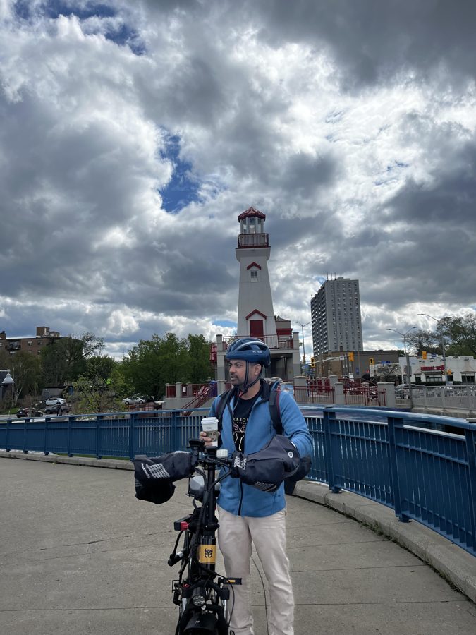 Vid with coffee and his bike at the Port Credit lighthouse